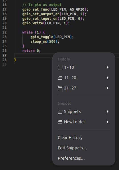The Clipix menu opened at the mouse pointer, on top of a code editor