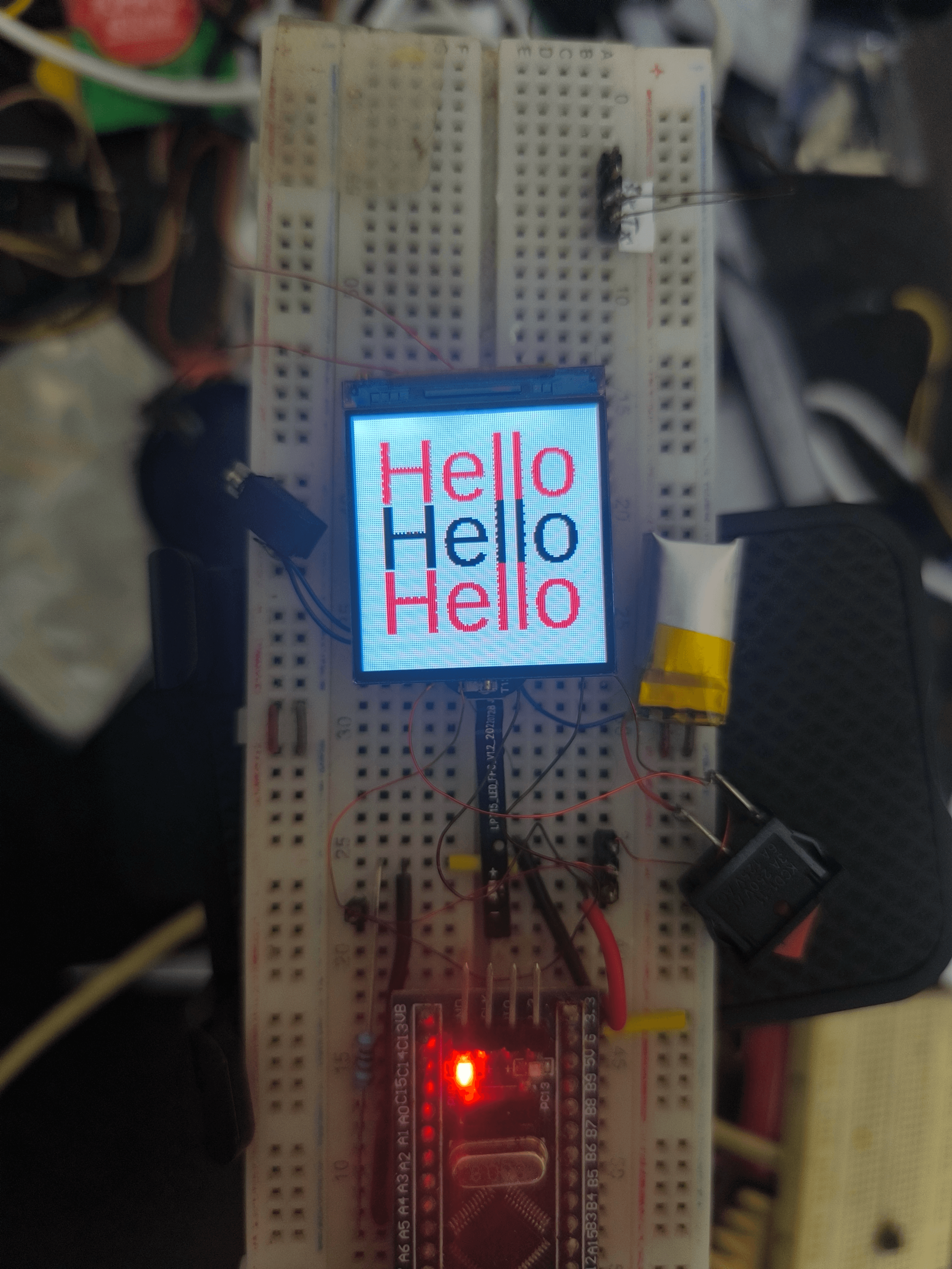 The watch showing three Hello lines uploaded over BLE